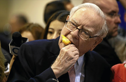 SWEET DEAL: Warren Buffett enjoys an ice cream before the Berkshire Hathaway annual meeting.