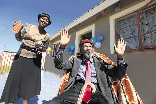 Themba Mkhize (118) and granddaughter Joyce Mkhize on the stoep of his new house in Ezakheni near Ladysmith in KwaZulu-Natal, which was handed over to him by Premier Zweli Mkhize yesterday