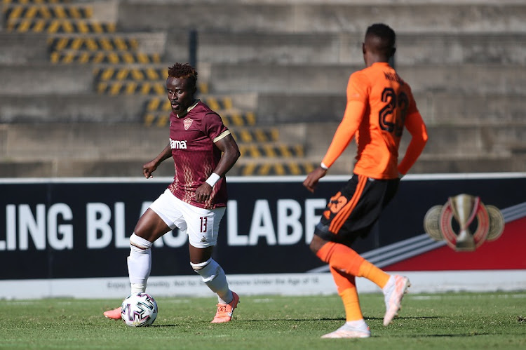 Augustine Dimgba of Stellenbosch FC attempts to get past Innocent Maela of Orlando Pirates during the DStv Premiership match between Stellenbosch FC and Orlando Pirates at Danie Craven Stadium on May 11, 2021 in Stellenbosch, South Africa.