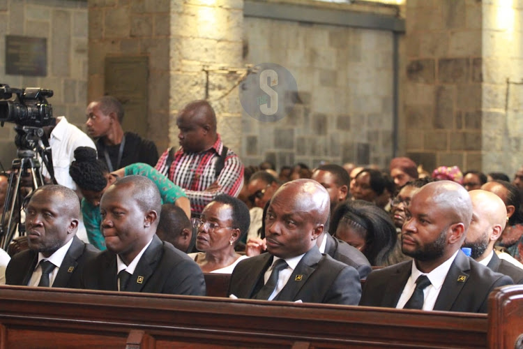 Brothers to the late Journalist Michael Oyier follow proceedings during a requiem mass at All Saints Cathedral on May 1, 2024.