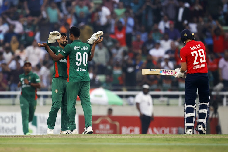 Bangladesh's Litton Das celebrates with Mustafizur Rahman after taking the wicket of England's Dawid Malan during their Third T20 at the Bangla National Cricket Stadium, Dhaka, Bangladesh on March 14, 2023. Picture: REUTERS/Adnan Abidi