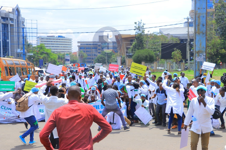 Healthcare workers hired by government under the Universal Healthcare program stage demonstrations on April 8, 2024.