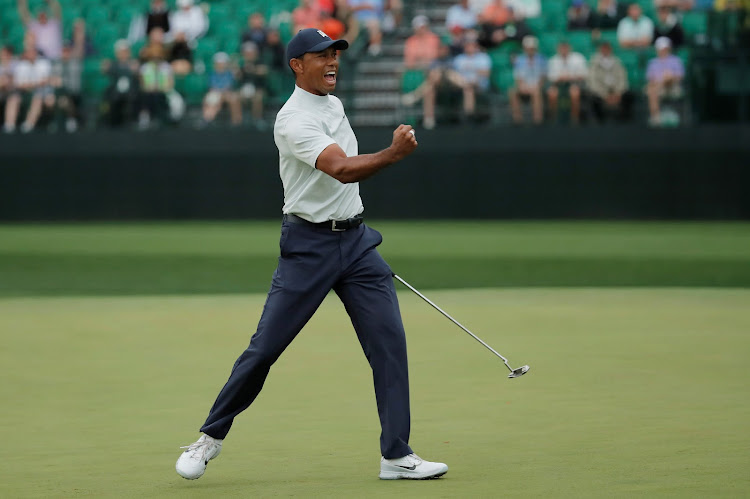 Tiger Woods of the U.S. celebrates a birdie putt on the 15th hole during second round play at the Masters at Augusta National Golf Club, Augusta, Georgia, U.S. April 12, 2019