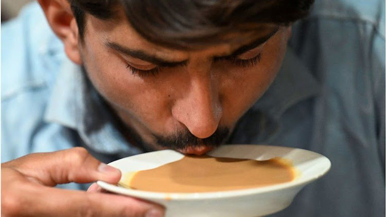 Pakistani man drinking tea or 'chai'.