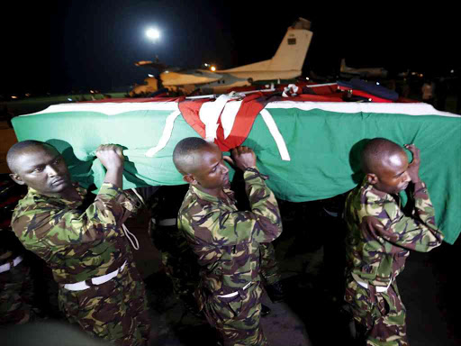 What can you do? KDF soldiers pay their last respects during the burial of a comrade killed by al Shabaab militia in El Adde, Somalia, on January 15.