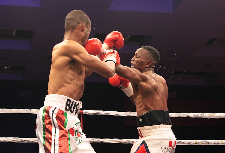 Khaya Busakwe, left, and Tshifhiwa Munyai fighting for South Africa lightweight title at Sandton Convention Centre.