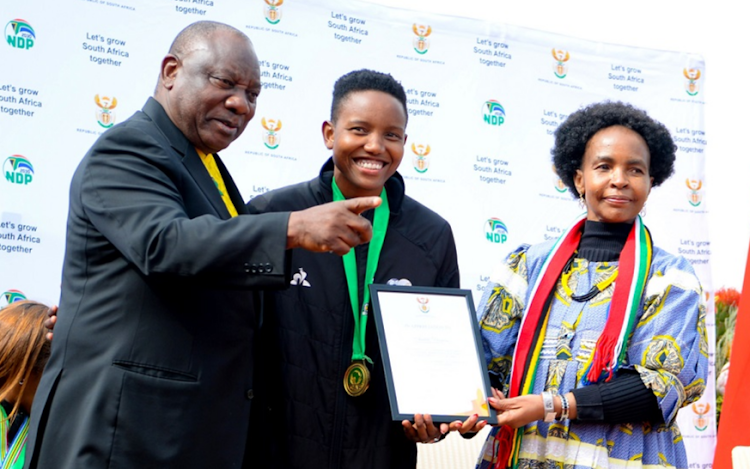 President Cyril Ramaphosa, Banyana Banyana goalkeeper Andile Dlamini and Maite Nkoana-Mashabane at the Union Buildings on July 27 2022.