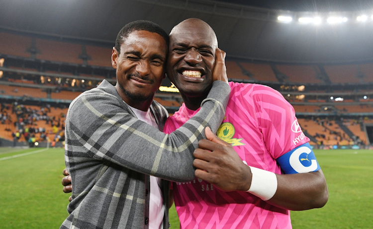 Mamelodi Sundowns coach Rulani Mokwena embraces goalkeeper Denis Onyango after clinching the DStv Premiership title with a 5-1 win against Kaizer Chiefs at FNB Stadium on Thursday night.