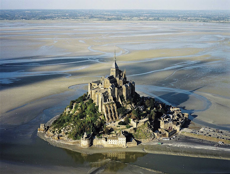 Aerial of historic Mont Saint Michel in Normandy, a UNESCO World Heritage site. It's accessible only when the tides recede.