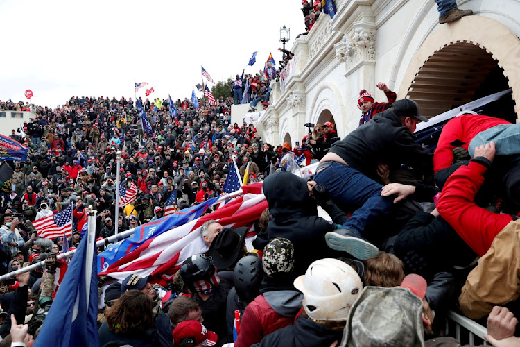 FILE PHOTO: More than 570 people have been charged in connection with the riot at the Capitol.