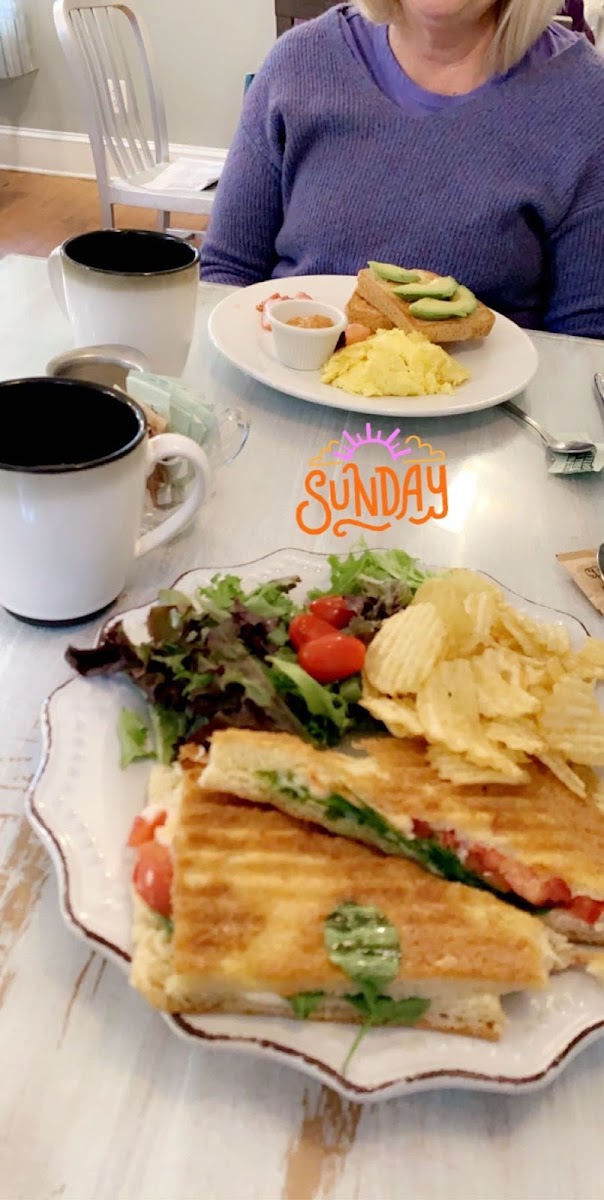 Tri color panini and scrambled eggs and toast with avocado