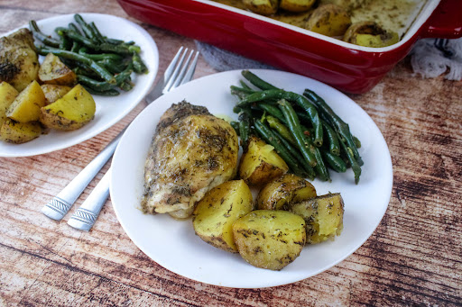 Greek Lemon Chicken With Potatoes on a plate.