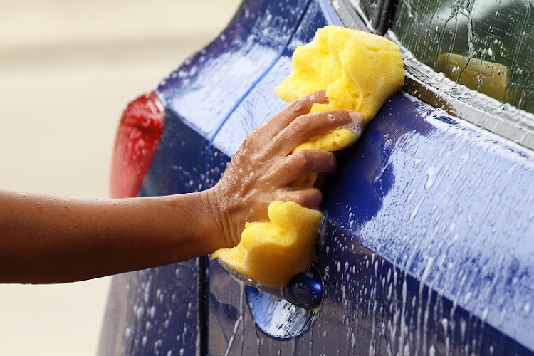 After years of searching for employment in vain, Ayanda Kunene started his small car wash business.