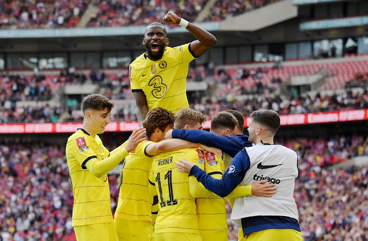 Chelsea players celebrate the goal by Mason Mount (obscured) in the FA Cup semifinal against Crystal Palace at Wembley Stadium in London on April 17 2022.