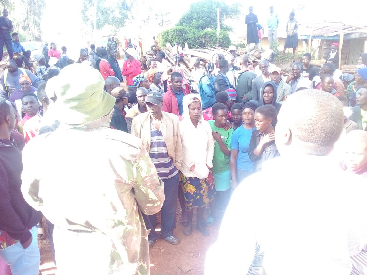 Security officials address angry parents of Rateti Secondary school on Wednesday Morning.