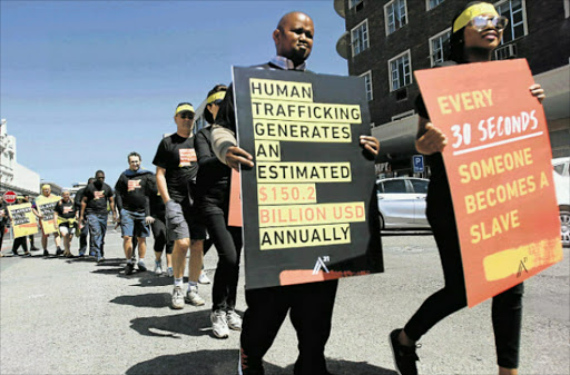 NO MORE: East London residents take part in an A21 anti-human trafficking march in the city. Men and women , young and old, took part in the protest through the streets of the city, and prayed outside a house that some claim is a hotspot for drug dealers, prostitutes and traffickers. Picture: SUPPLIED