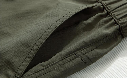 Title 9, Multi-pocket quick-drying shorts designed for o...