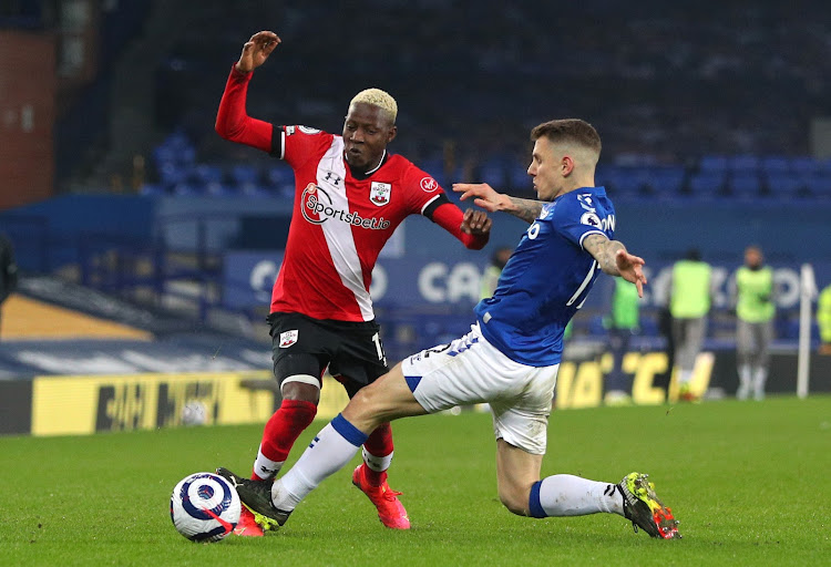 Southampton's Moussa Djenepo in action with Everton's Lucas Digne