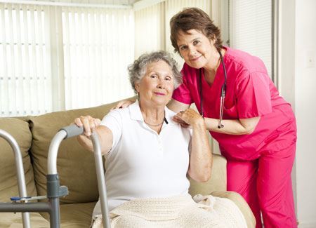 A caregiver assists a long-term care resident in assisted living