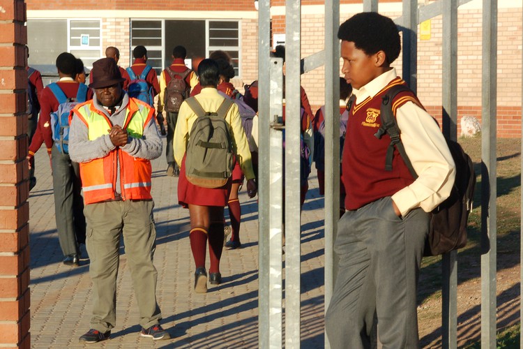 Sisipho Mantla (13) outside the gates of VM Kwinana Secondary School in KwaNobuhle, Uitenhage. He has been sent home repeatedly for refusing to cut his hair.