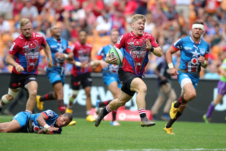 Morne van der Berg of the Lions goes for the try line.