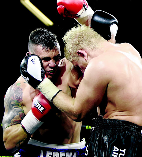 Kevin Lerena with Micki Nielsen of Denmark during their fight at Emperors Palace. PHOTO: ANTONIO MUCHAVE