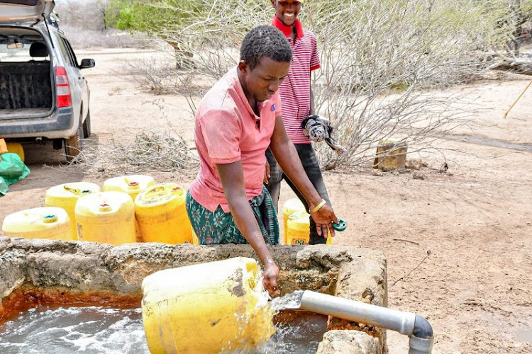 A man fetches water from a borehole in Afuene, Lagdera subcounty.