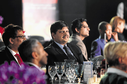 Business tycoon Atul Gupta, one of the owners of Africa News Network 7, at the glitzy launch of the channel in Sandton this week. Iqbal Survé, owner of Independent Newspapers, is partially obscured on the left