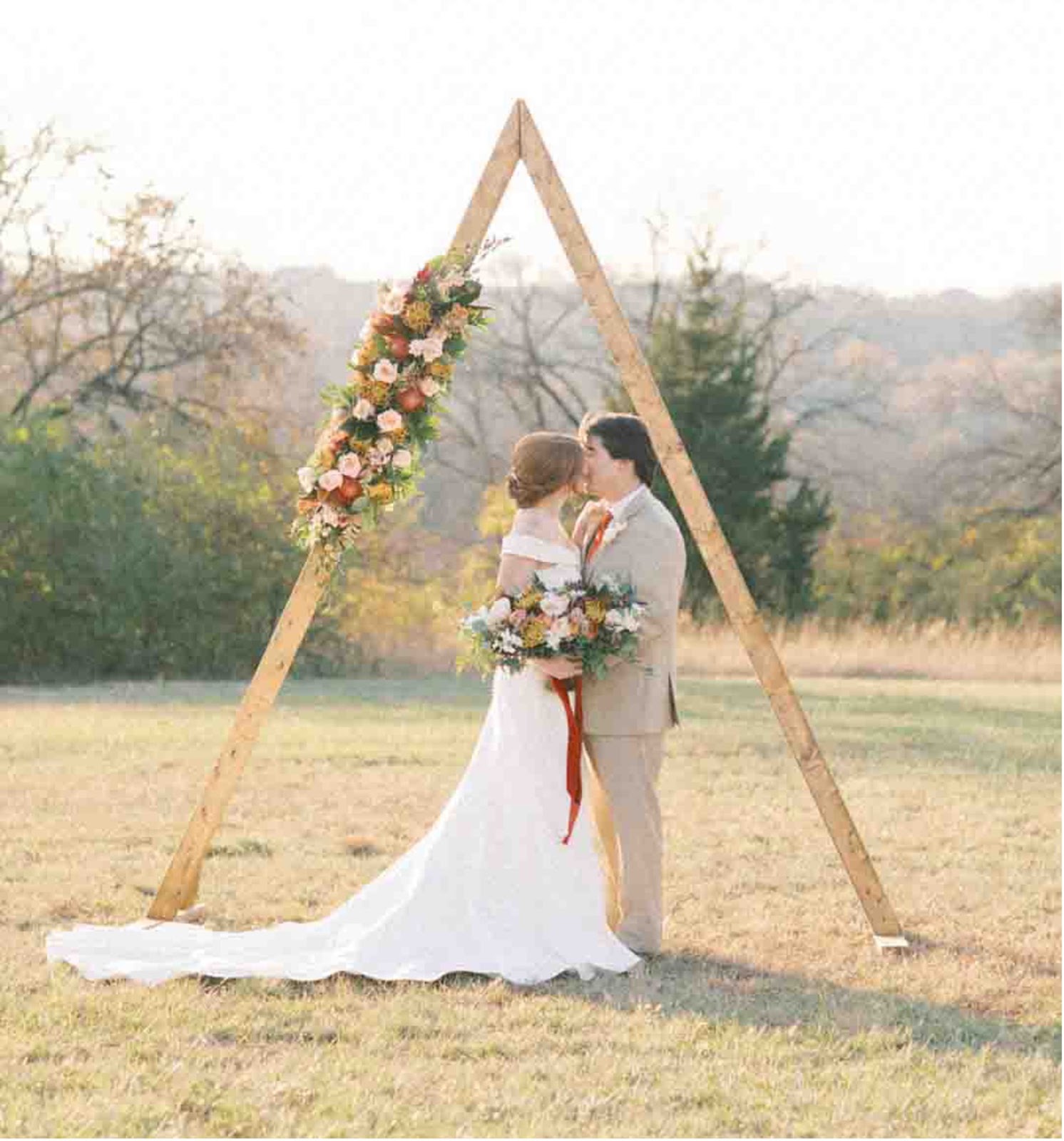 burnt orange wedding altar with geometrical frame