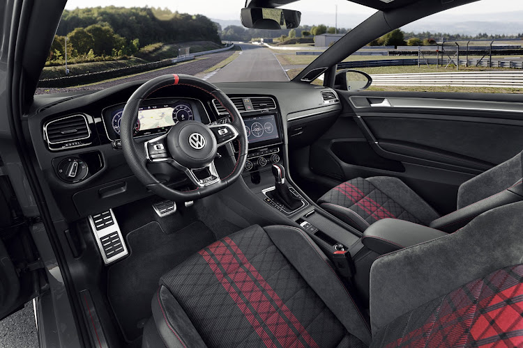 The cabin is vamped up with red and black accents and a perforated steering wheel.