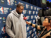 Team Africa co-captain Luol Deng doing media interviews. 