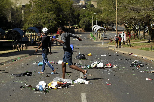 TUT students burnt items, scattered the rubbish bins on campus and broke gates.