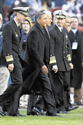 RESOLUTE:
      
      
      
       President Barack Obama 
      
      and his deputy 
      
      Joe Biden 
      
       walk to midfield for the coin toss before the start of the 112th annual Army-Navy Game at FedEx Field  in Maryland at the weekend.  
       PHOTO: GETTY IMAGES