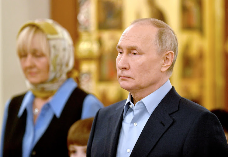 Russia's President Vladimir Putin attends the Orthodox Christmas liturgy at a cathedral outside Moscow, Russia, January 7 2024. Picture: SPUTNIK/MIKAHIL VOSKRESENSKIY/REUTERS