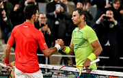 Rafael Nadal of Spain greets Novak Djokovic of Serbia after their French Open quarterfinal at Roland Garros on May 31 2022.