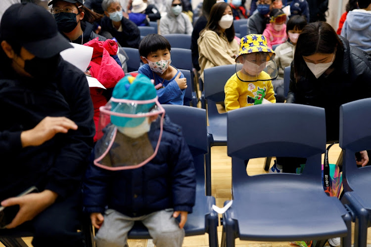 Children rest at a community vaccination centre, after receiving a dose of Sinovac Biotech's CoronaVac vaccine, following the Covid-19 outbreak, in Hong Kong, China.