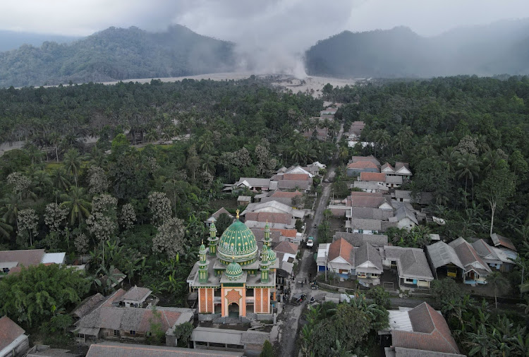 An aerial view of Sumber Wuluh village covered with volcanic ash following the eruption of Mount Semeru volcano in Lumajang regency, East Java province, Indonesia, December 5, 2021. Picture taken with a drone.