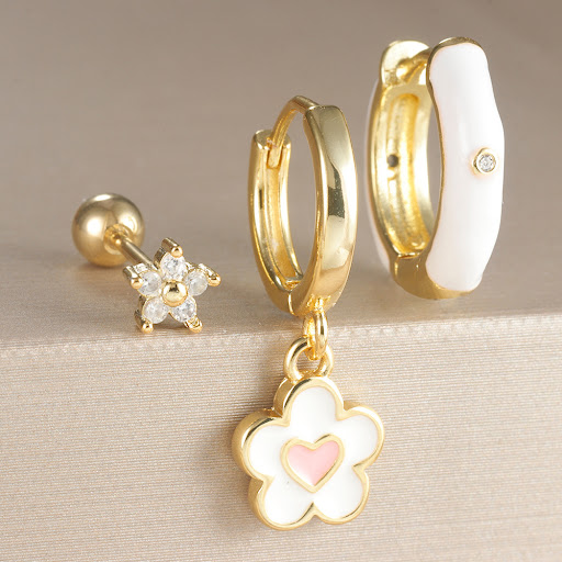 Title 6, Niche Design ear clip earrings, featuring an oi...