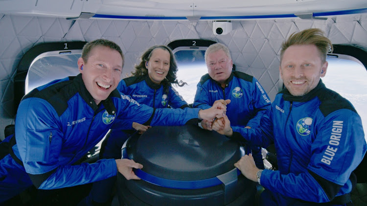 Star Trek actor William Shatner poses with Audrey Powers, Blue Origin's vice president of mission and flight operations and a former NASA flight controller and engineer; Chris Boshuizen, the co-founder of satellite company Planet Labs and a former space mission architect for NASA; and Glen de Vries, the co-founder of Medidata Solutions, a life science company during the Blue Origin New Shepard mission NS-18 suborbital flight near Van Horn, Texas, U.S. on October 13, 2021.