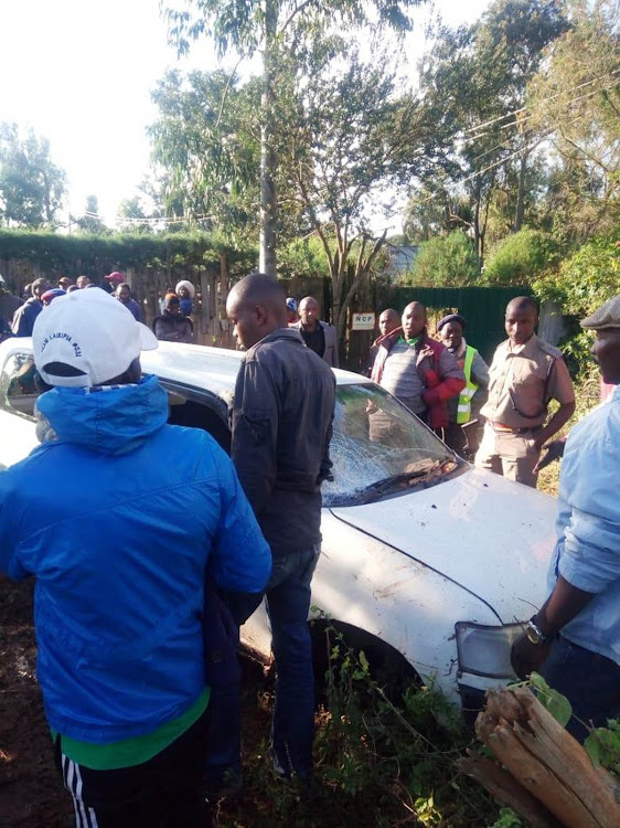 Members of the public surround the vehicle that was ferrying stolen goats and sheep at Muthaiga Estate in the outskirts of Nanyuki town