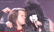 Caleb Johnson performs with Kiss at the 13 Session of American Idol