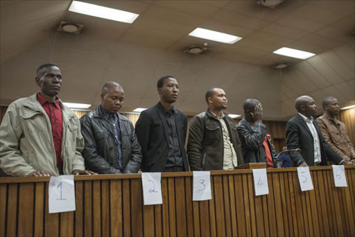 Some of the eight police officers convicted in the murder trial of Mozambican taxi driver Mido Macia in the dock.