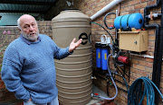 Brian Brooks of Tokai explains the tank‚ filters and pumps that allow him to run his house off his borehole. 