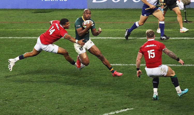 Makazole Mapimpi tries to get past Anthony Watson and Stuart Hogg of the British & Irish Lions.