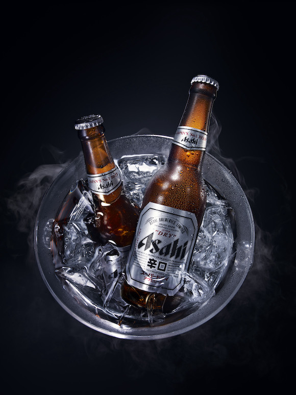 Asahi beer bottles in bucket of ice