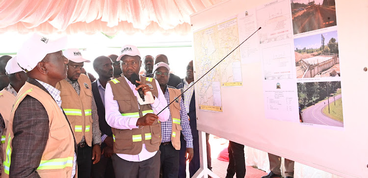 President William Ruto being briefed at the launch of Kyogong- Kapkesosio- Sigor- Longisa Road in Chepalungu sub county, Bomet on March 16, 2024