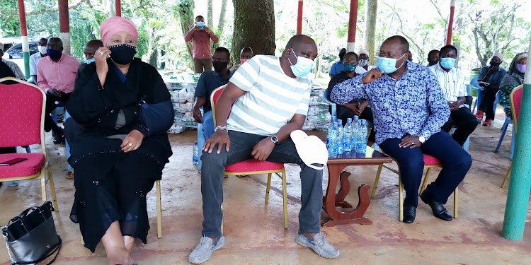 Ahadi Kenya CEO Stanley Kamau and county commissioner Karuku Ngumo at Kwale Baraza park in Matuga.