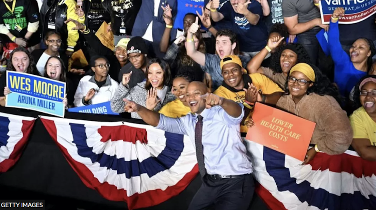 Wes Moore (centre) looks set to become the third black governor ever elected in the US