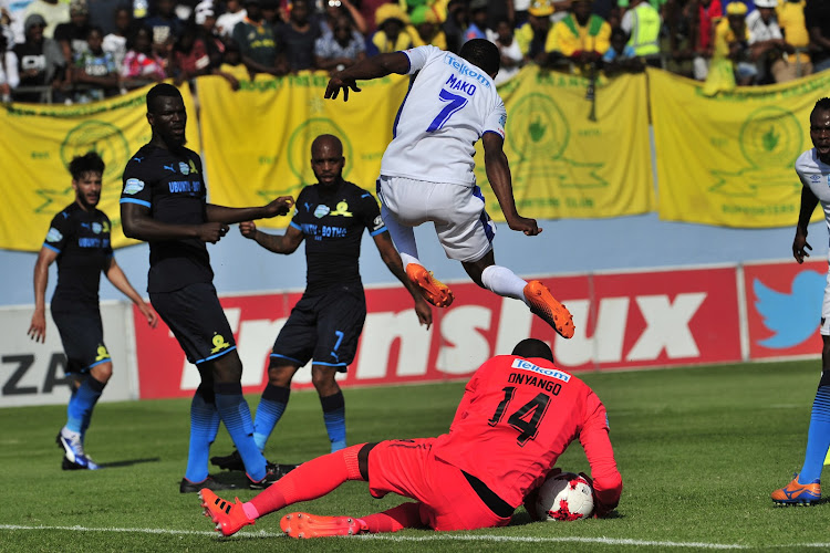 Denis Onyango of Mamelodi Sundowns and Paseka Mako of Chippa United jumping over him during the2017 Telkom Knockout game between Chippa United and Mamelodi Sundowns at Sisa Dukashe Stadium in East London on 29 October 2017.