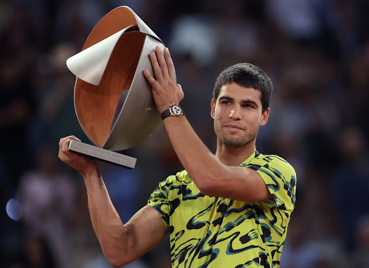 Carlos Alcaraz of Spain celebrates victory with the tournament trophy after the Men's Singles Final match against Jan-Lennard Struff of Germany on Day Fourteen of the Mutua Madrid Open at La Caja Magica on May 7 2023 in Madrid, Spain. Picture: JULIAN FINNEY/GETTY IMAGES